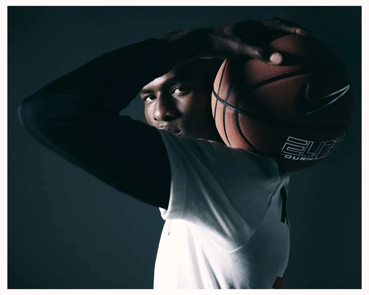 Professional athlete portrait with basketball - Calgary sports photography by Media&Motion, capturing focus, motion, and strength.