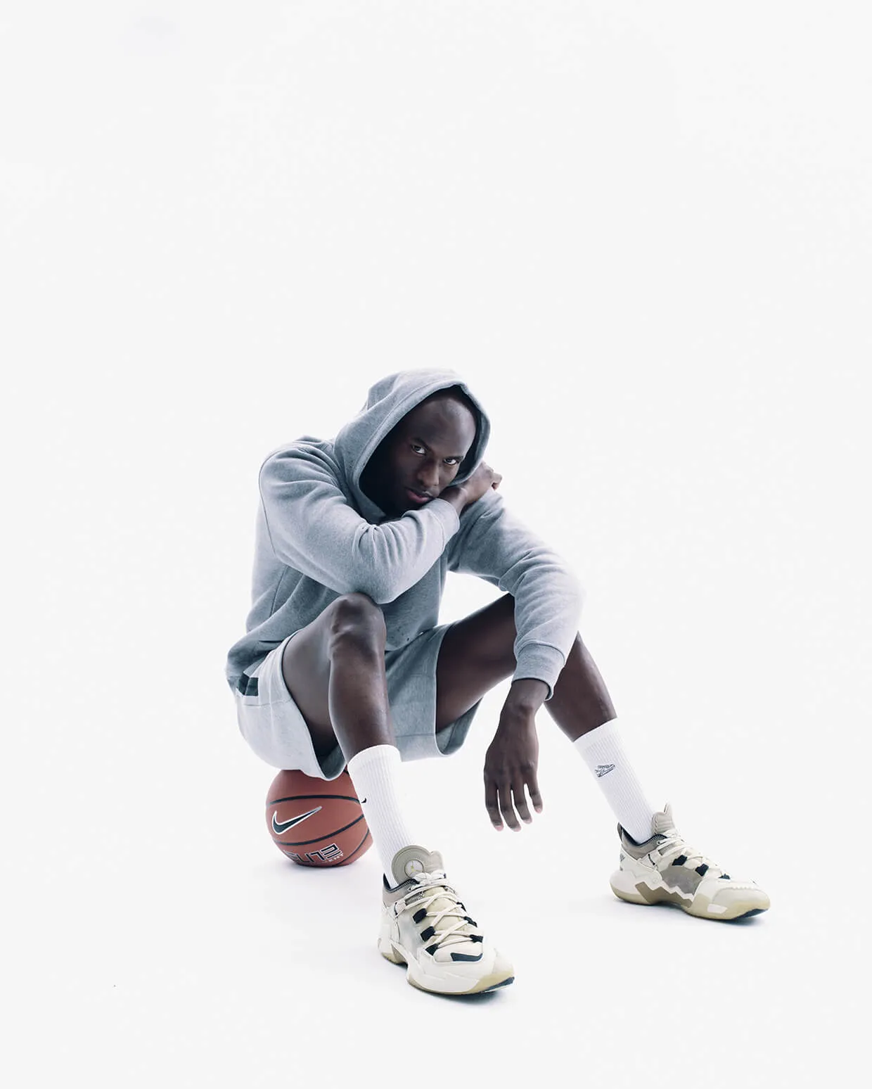 Calgary athlete portrait in studio - basketball-themed branding shoot by Media&Motion, highlighting style, focus, and performance.