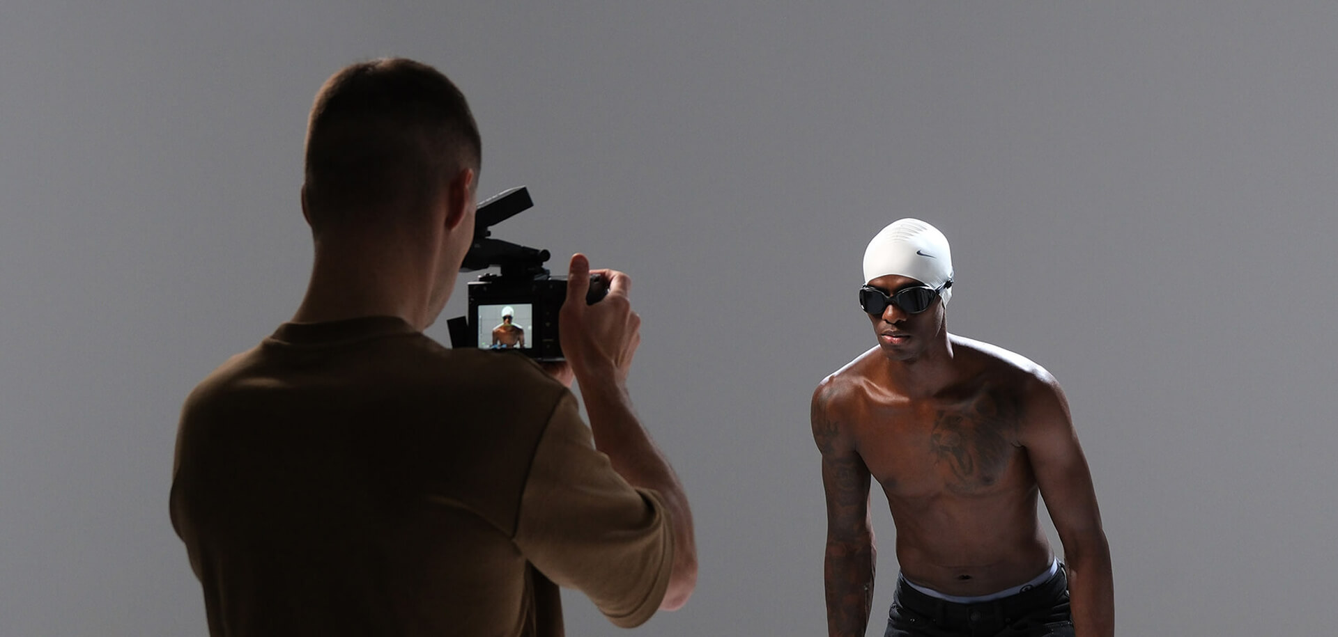 Behind the scenes of Calgary swim photography session featuring athlete branding production in controlled studio lighting.