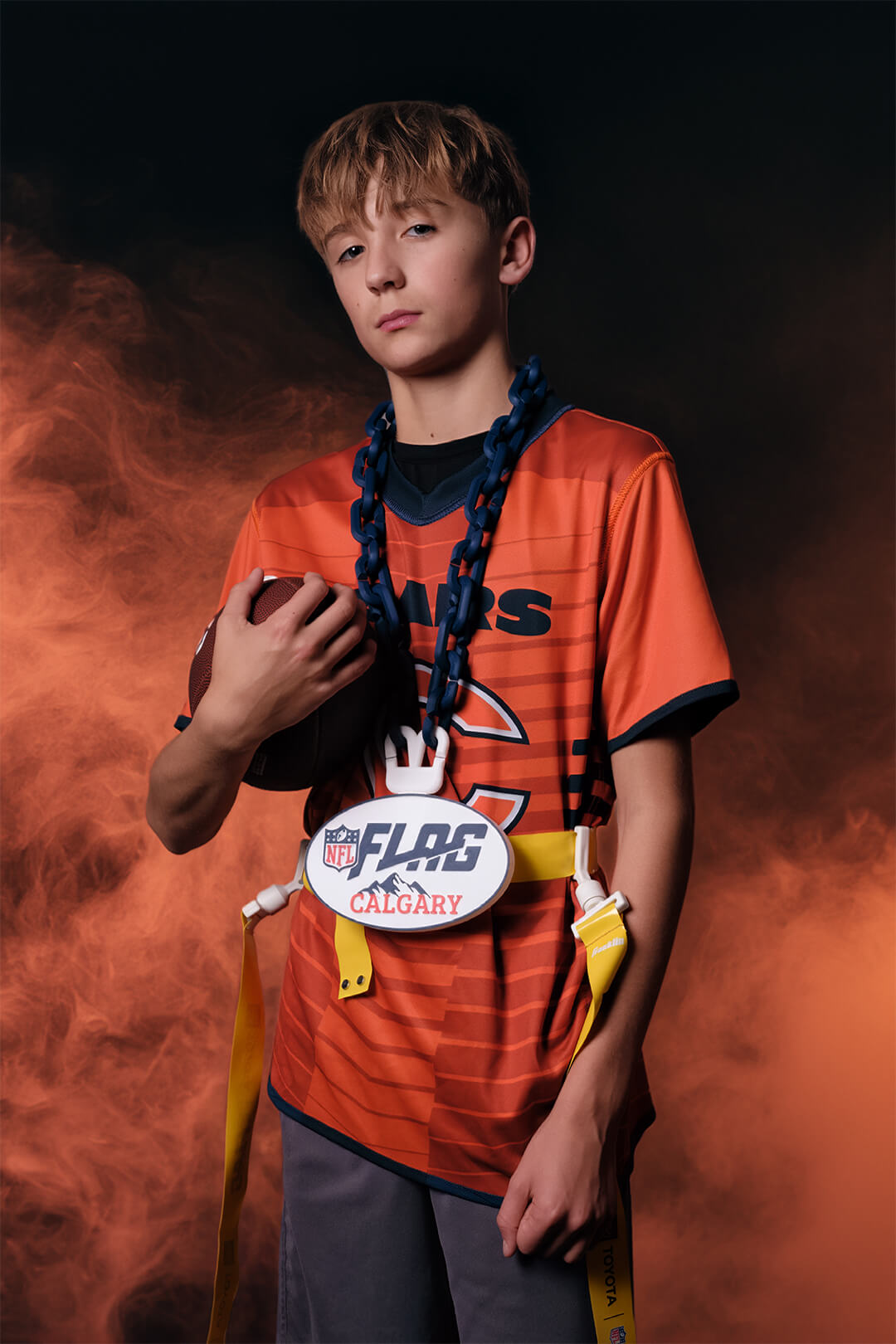 NFL Flag Calgary youth athlete portrait emphasizing confidence and foundational skill development.