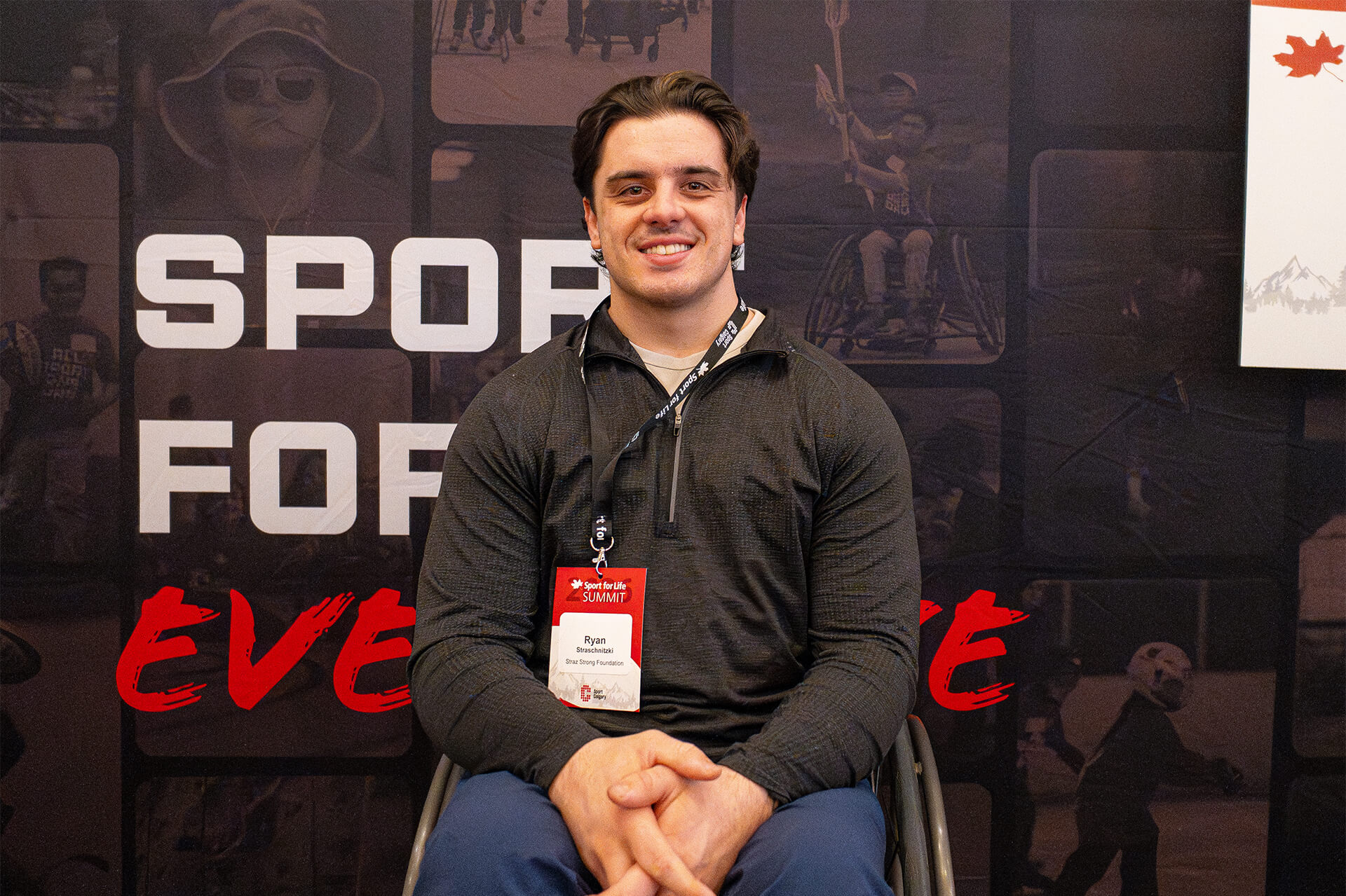 Conference attendee portrait captured at Sport for Life Summit media wall during national sport leadership event.