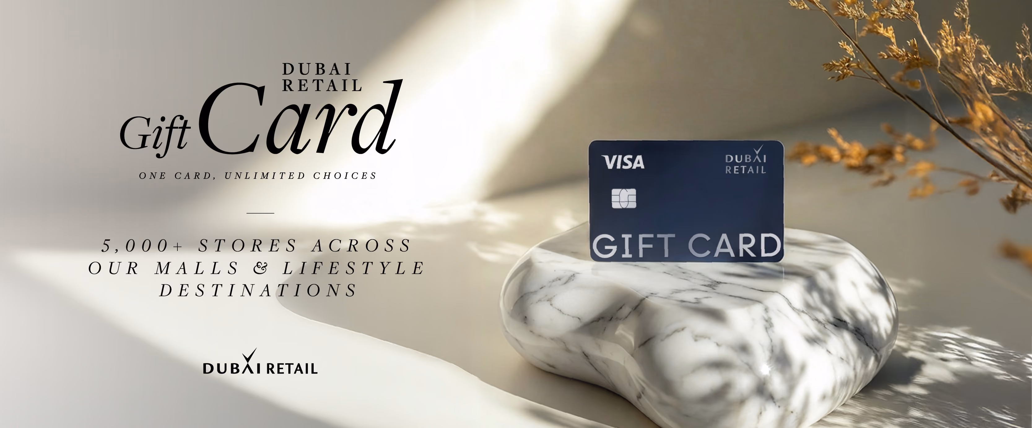 Dubai Retail Visa gift card on marble stand with text about 5,000+ stores in malls and lifestyle destinations.