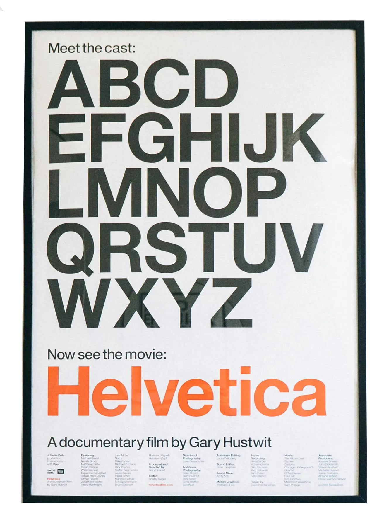 letters of the alphabet and the word 'helvetica' on a poster
