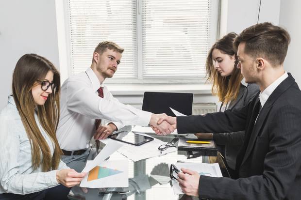 A client handover meeting in an office