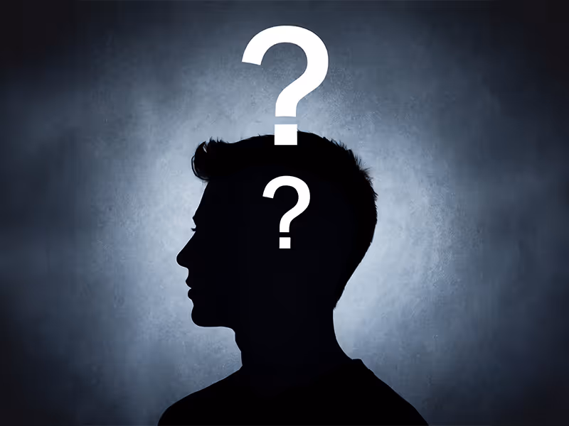 Shadow profile of a person with a question mark