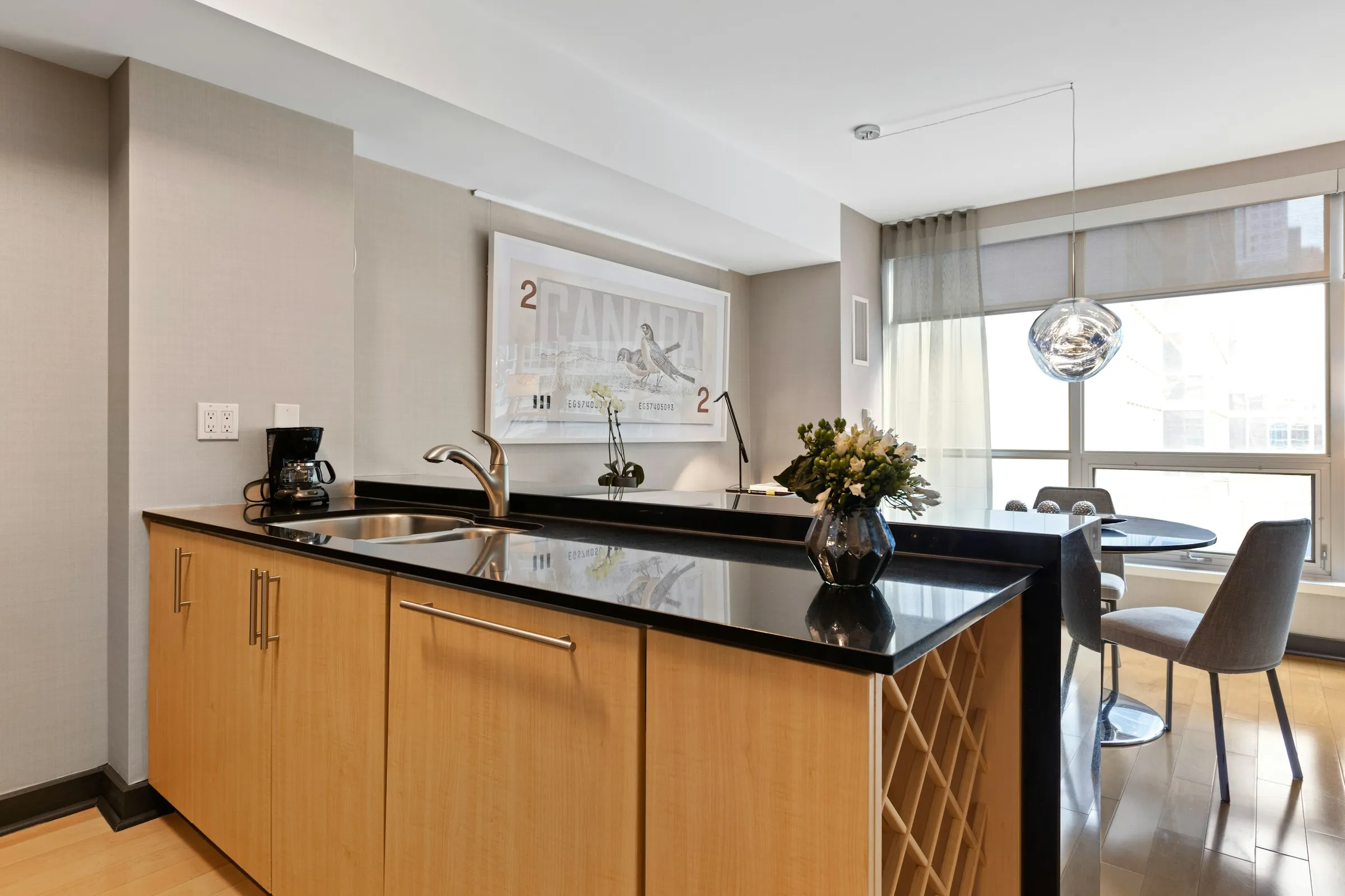 A kitchen with wood cabinetries and storage for vine bottles - Carpentry Web design Webflow Template