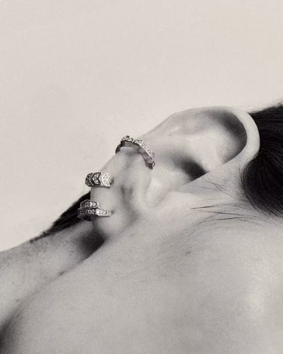 woman ear with earrings