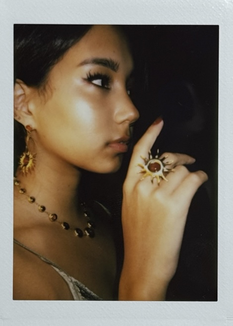 woman ear with earrings