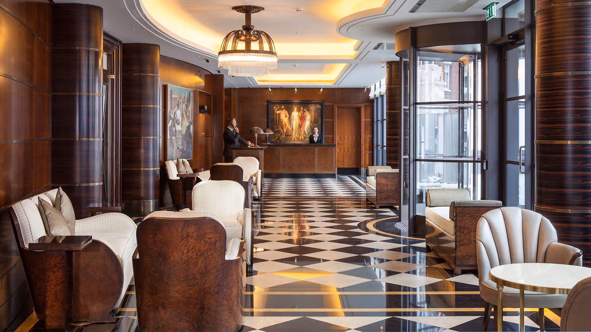 Luxurious hotel lobby with art deco design, checkered floor, and elegant furniture