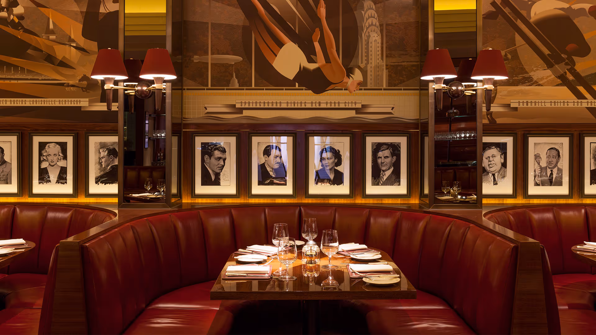 Vintage restaurant interior with red leather booths and famous portrait gallery