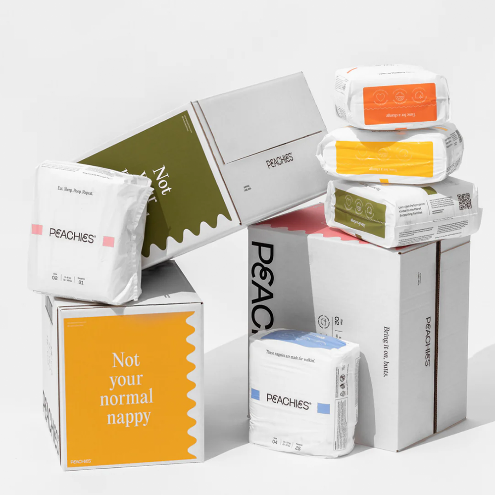 A stack of nappy packages and boxes in a studio environment.