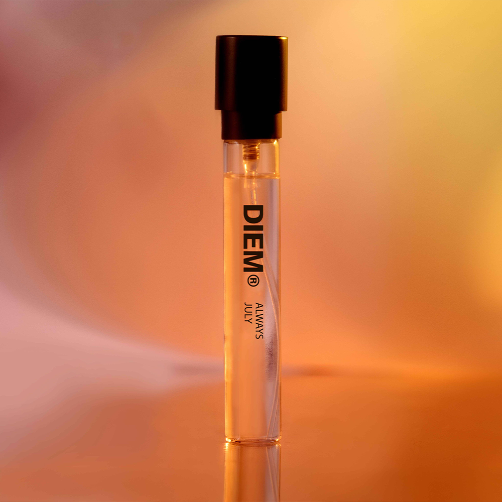 A Diem perfume sample in a gradient orange studio environment background.