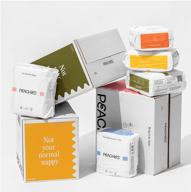 A stack of nappy packages and boxes in a studio environment. 
