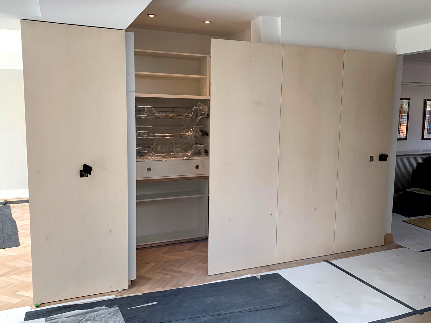 Kitchen storage wall by the Greenwich Alcove Company