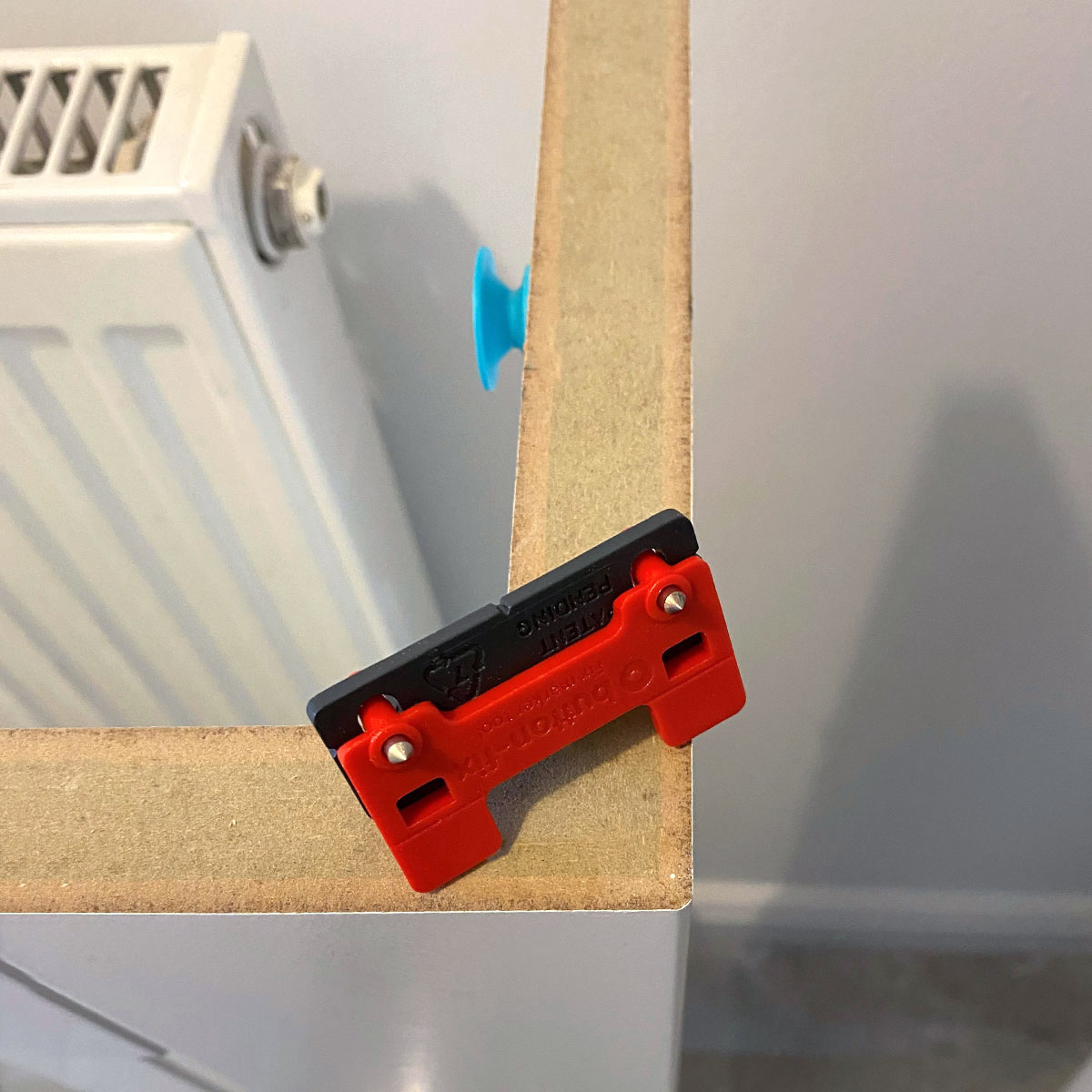 Surefit Fitted Furniture radiator cover using Button-fix