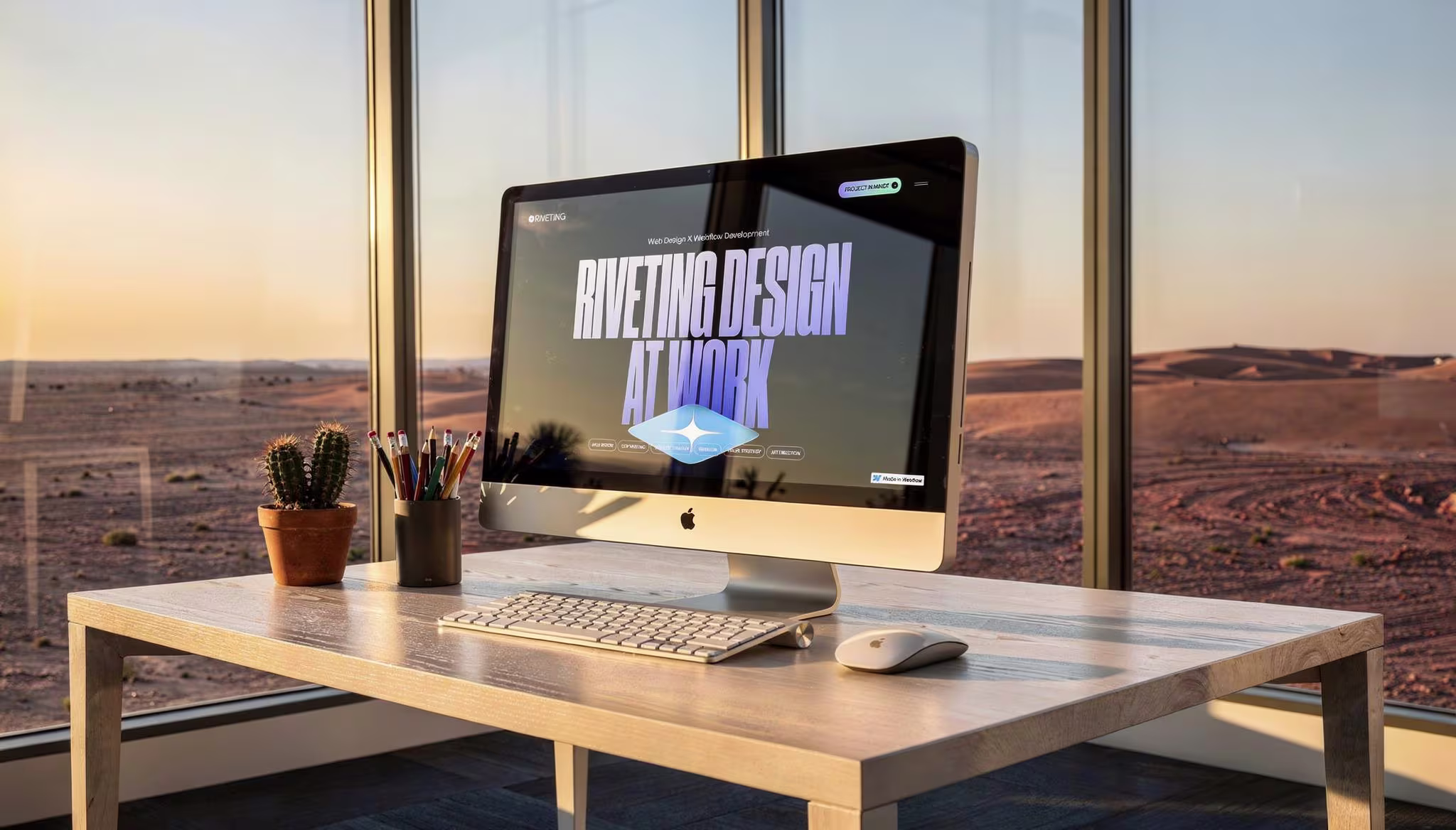 A floating laptop displaying a recent project built by Riveting Design.