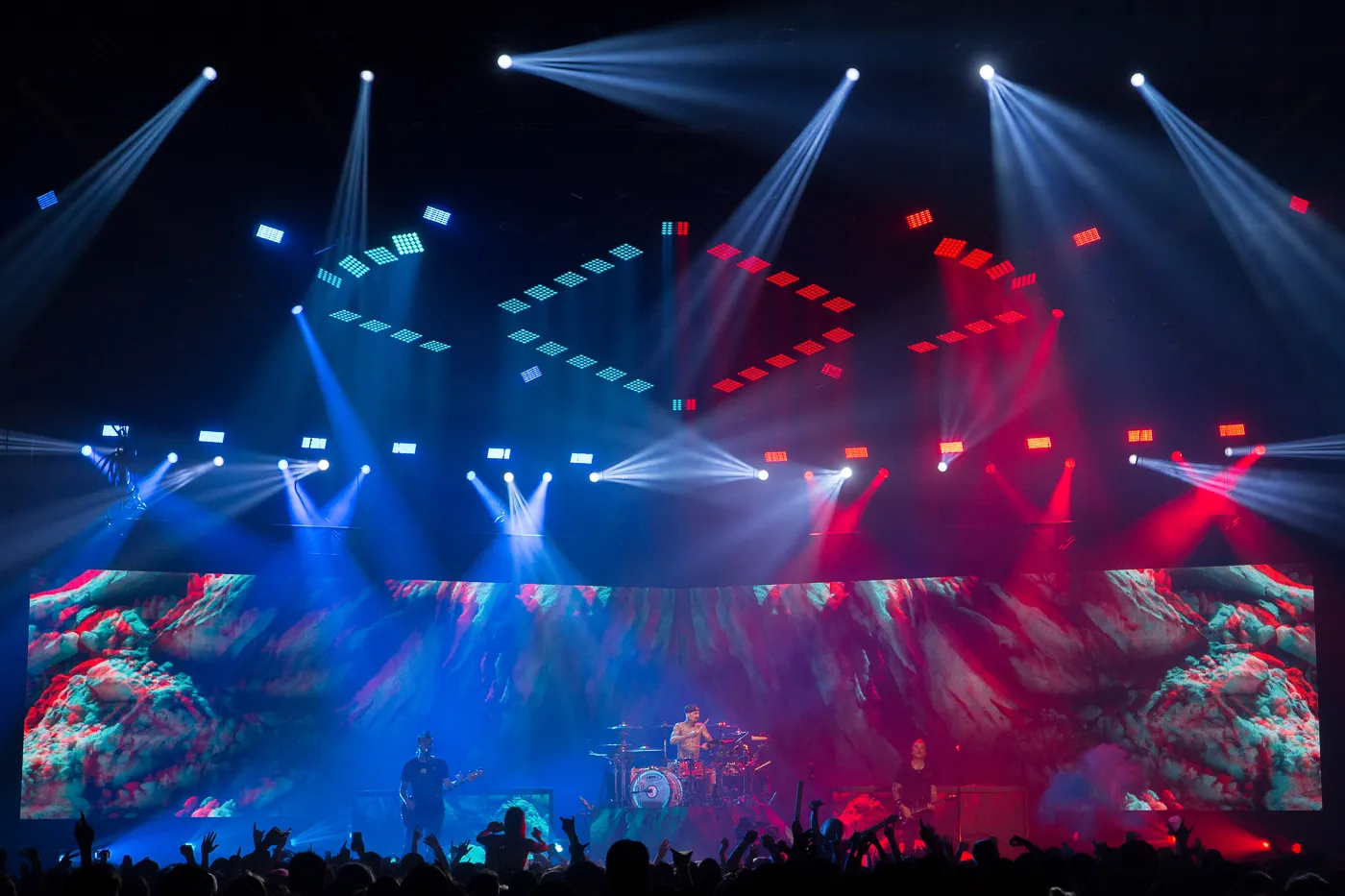 Blink 182 on stage with a spectacular stage show around them