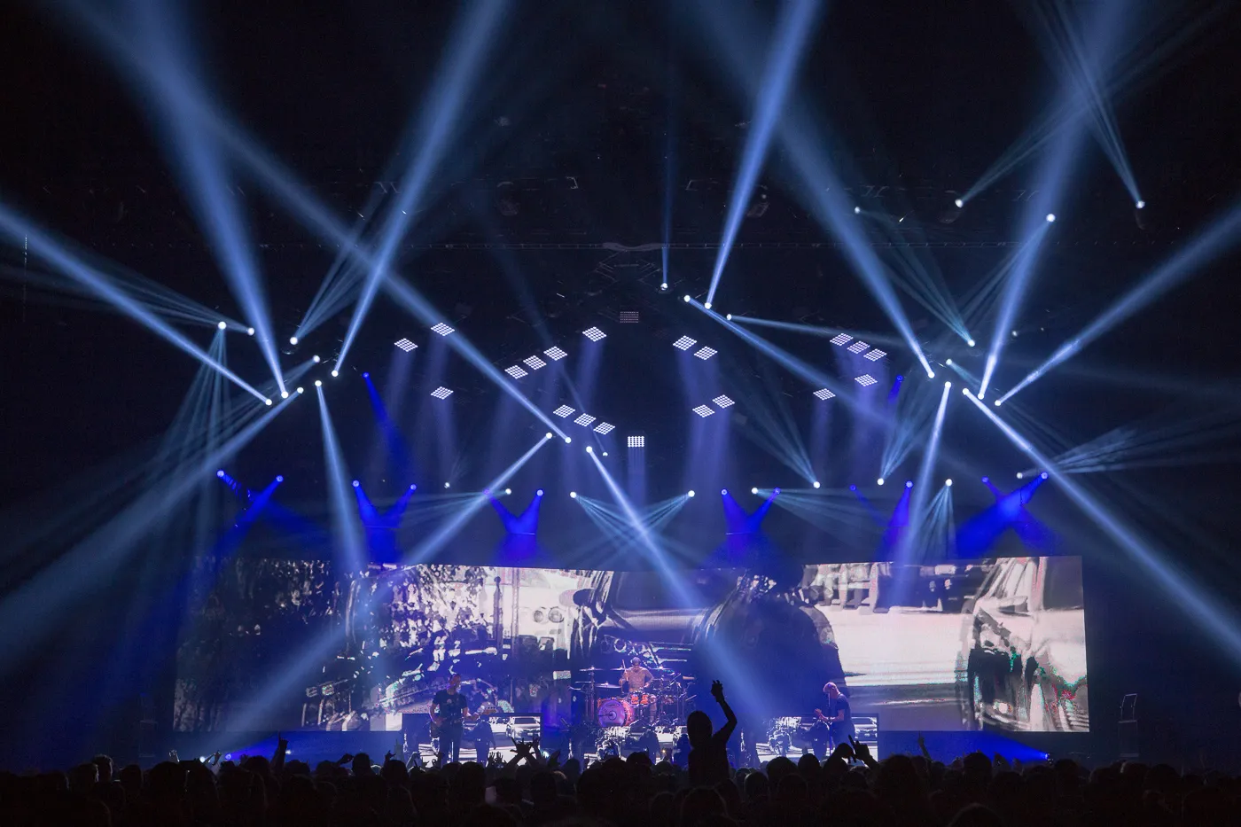 Blink 182 on stage with a spectacular stage show around them