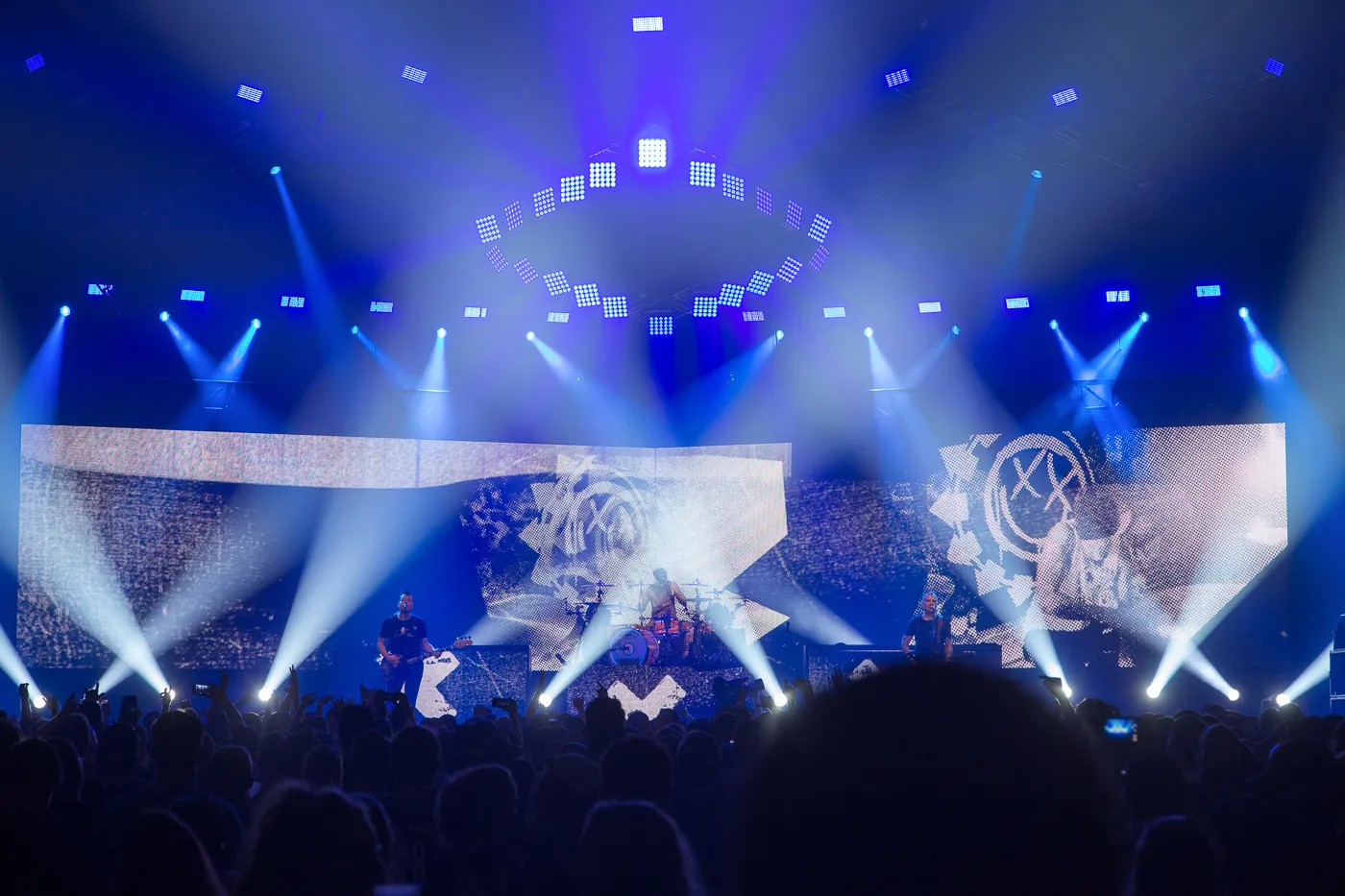 Blink 182 on stage with a spectacular stage show around them