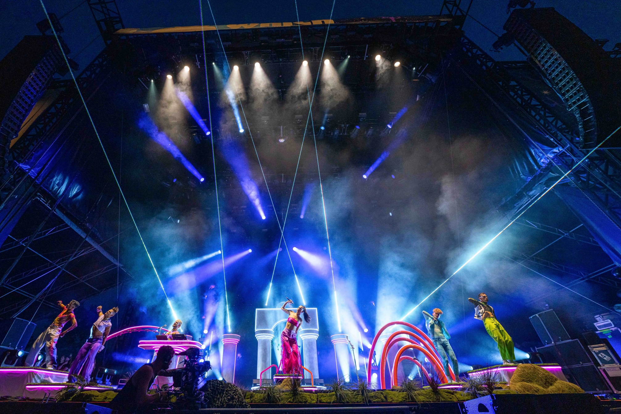 Sofi Tukker surrounded by Bob's Dance Shop dancers in front of the stage set.