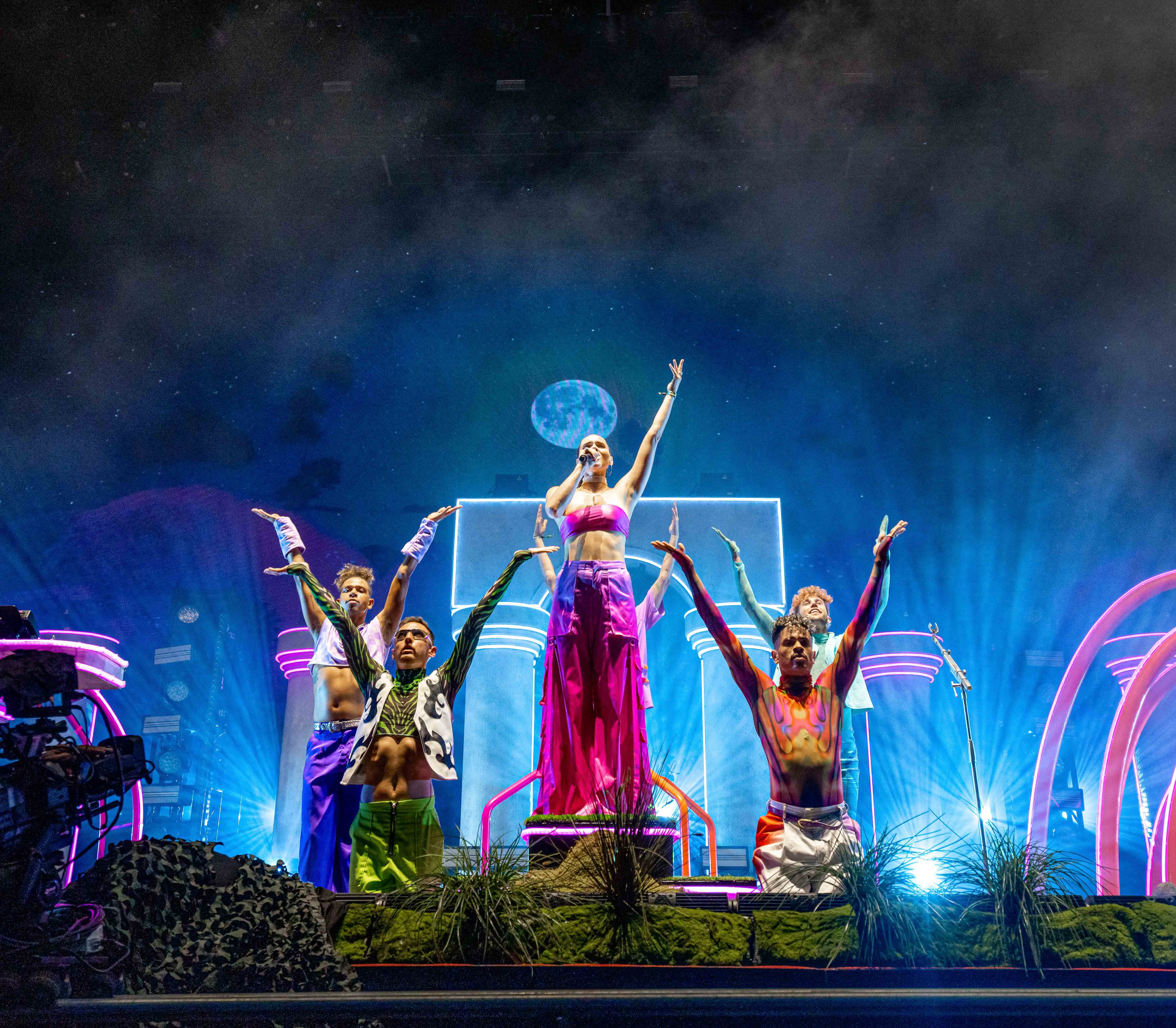 Sofi Tukker surrounded by Bob's Dance Shop dancers in front of the stage set.