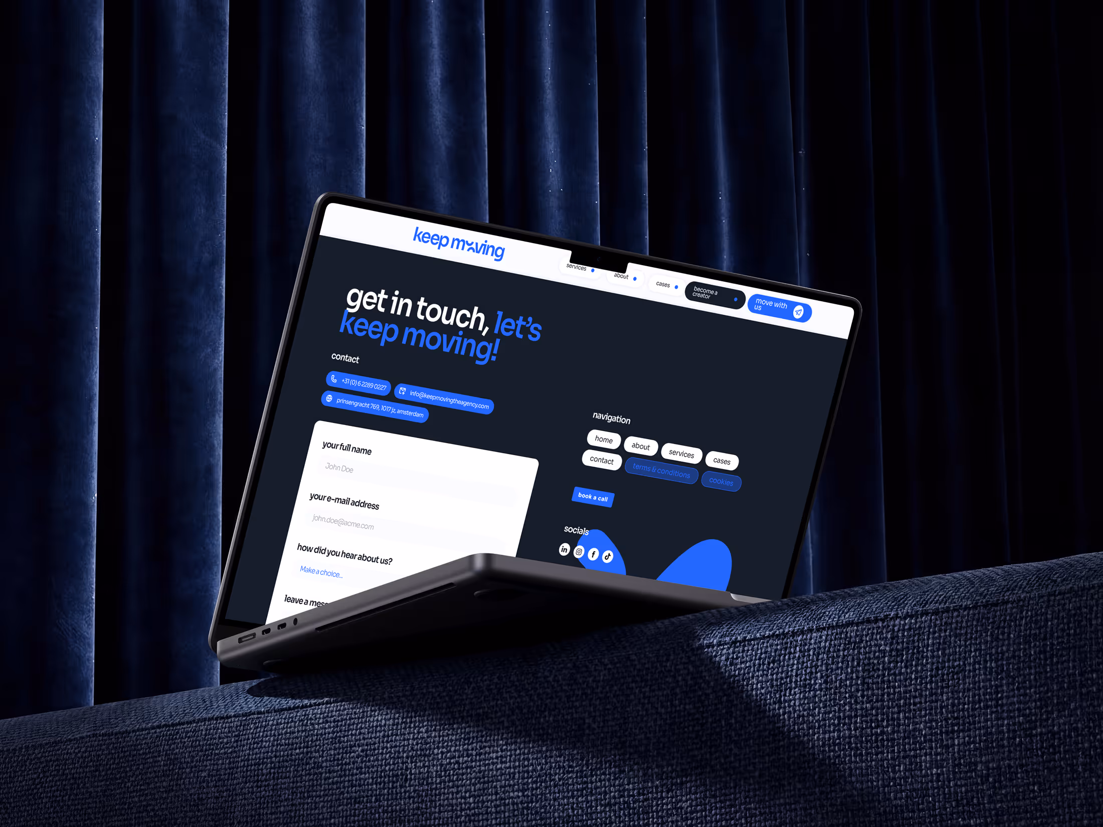 Laptop displaying a dark-themed contact form webpage titled 'get in touch, let’s keep moving!'