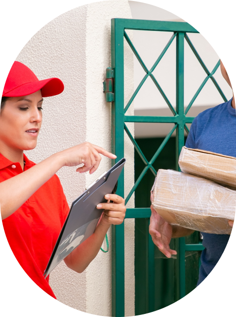 Woman in a blue and red uniform delivering moving boxes to a customer's door for IMG Removals in Birmingham—professional local relocation service