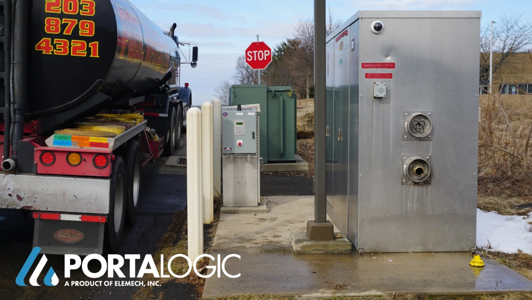 Truck connected to bulk water dispensing station access panel