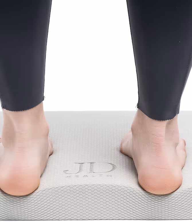 Close-up of feet on Jeyde Health Balance Pad