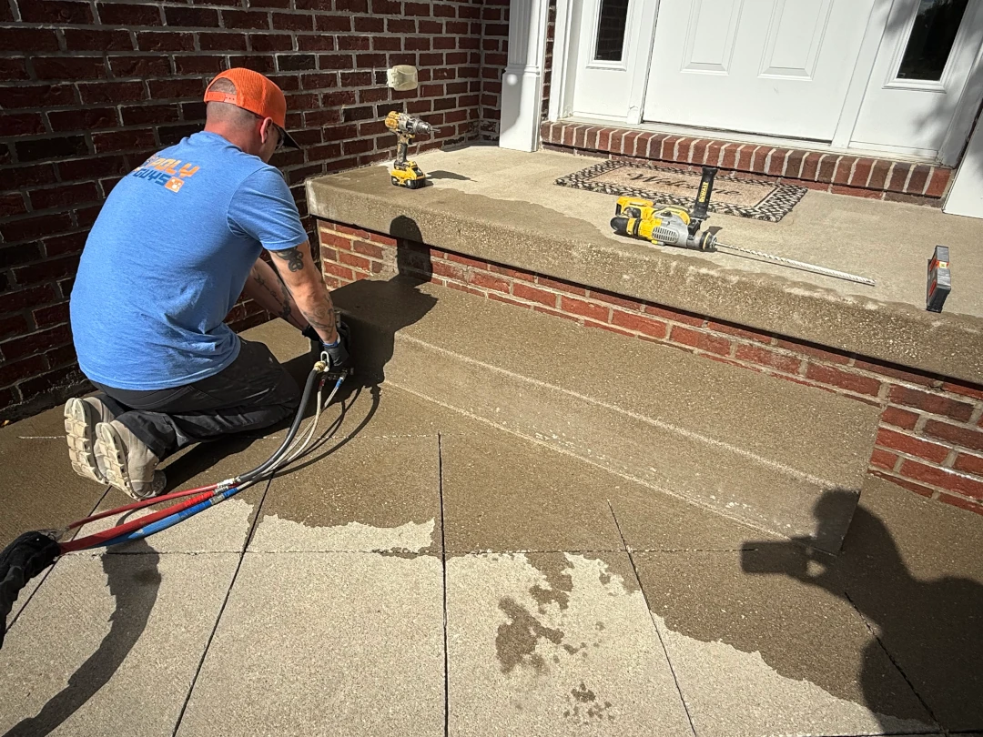 Polyurethane foam injection under front porch pad and steps during lifting in Doylestown
