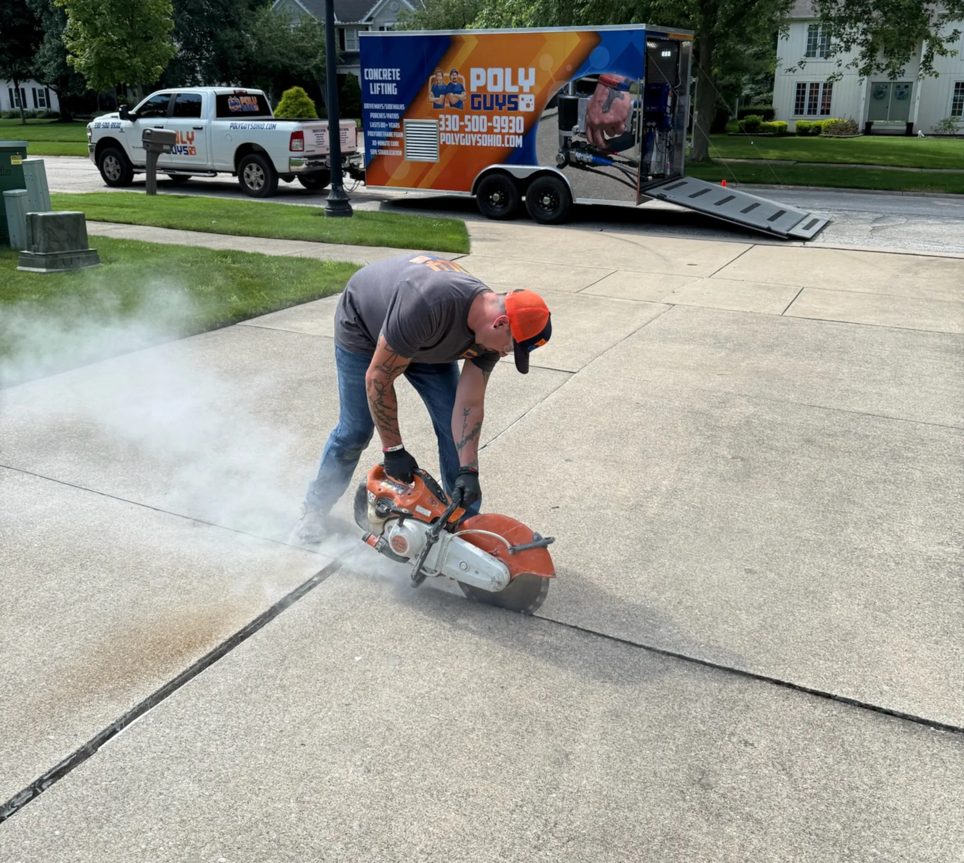 Poly Guys cutting into a concrete driveway to prepare concrete lifting