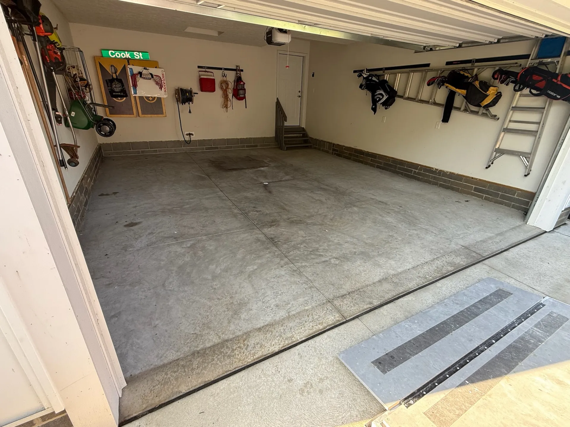 before view of a concrete gargae floor looking worn down and damaged