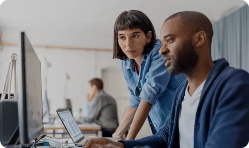 Sales and operations team sitting together in a modern office during a team meeting