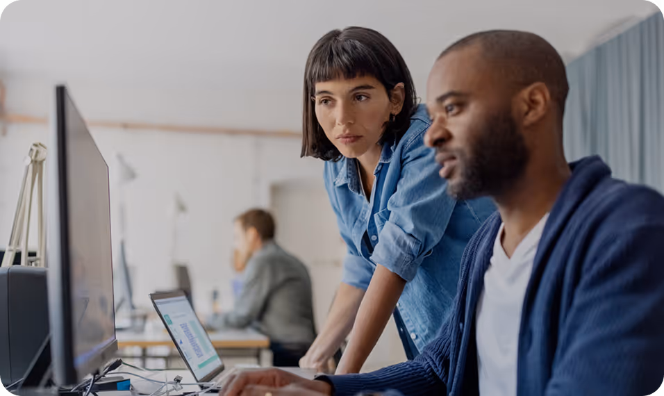 Sales and operations team sitting together in a modern office during a team meeting