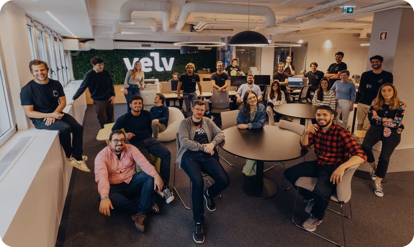 Sales and operations team sitting together in a modern office during a team meeting