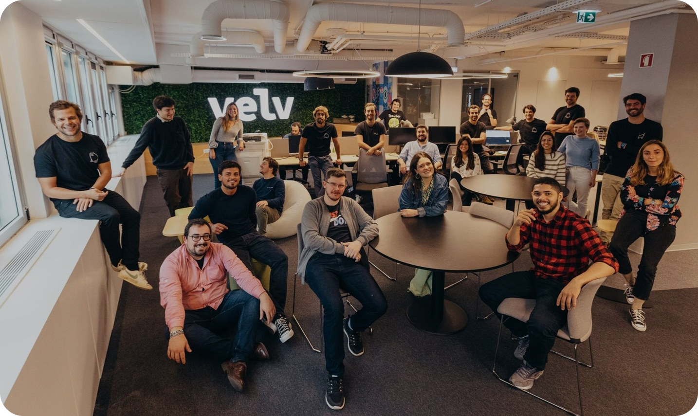 Sales and operations team sitting together in a modern office during a team meeting