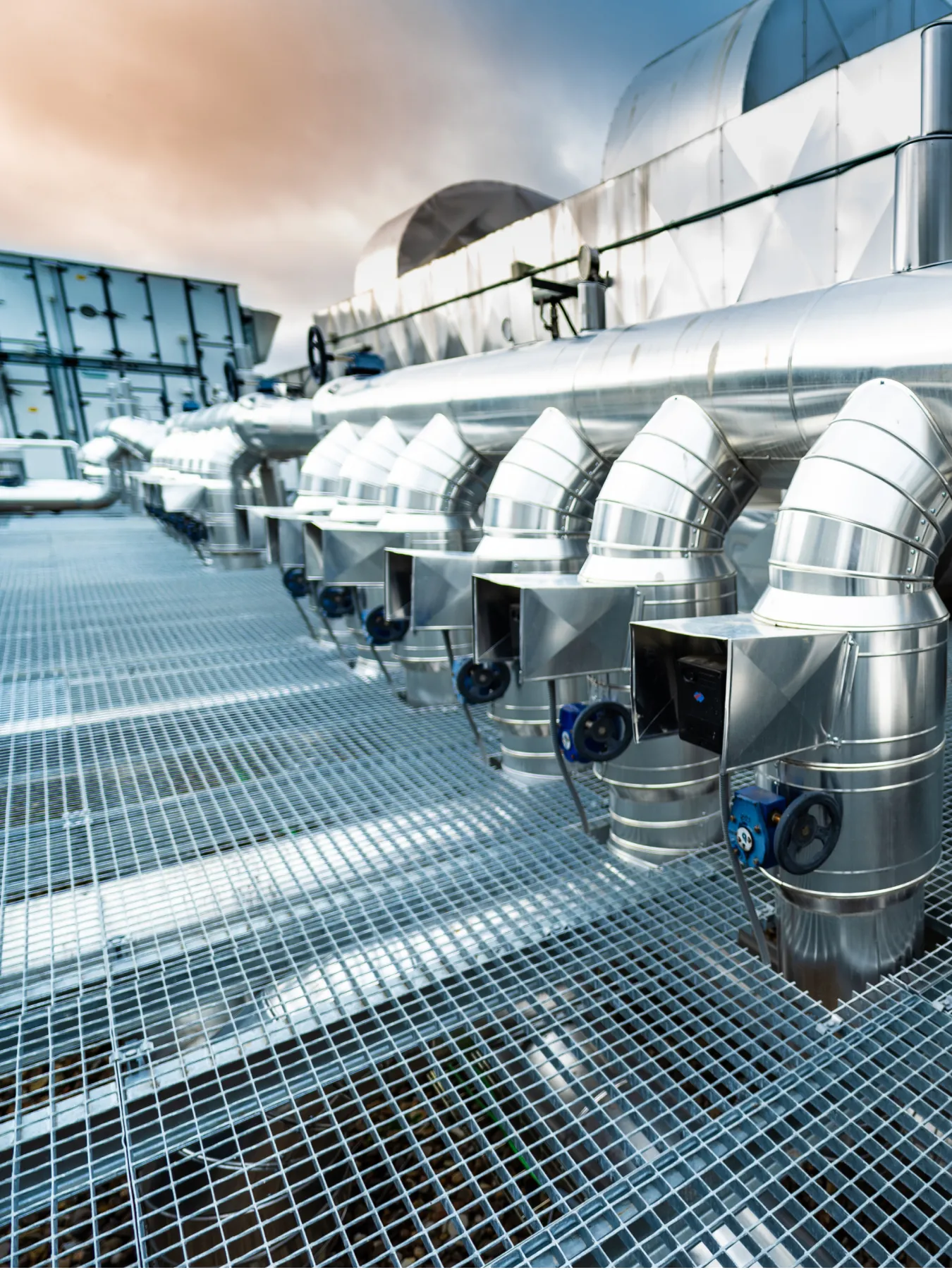 Ducts and air conditioning units on a roof top setting.