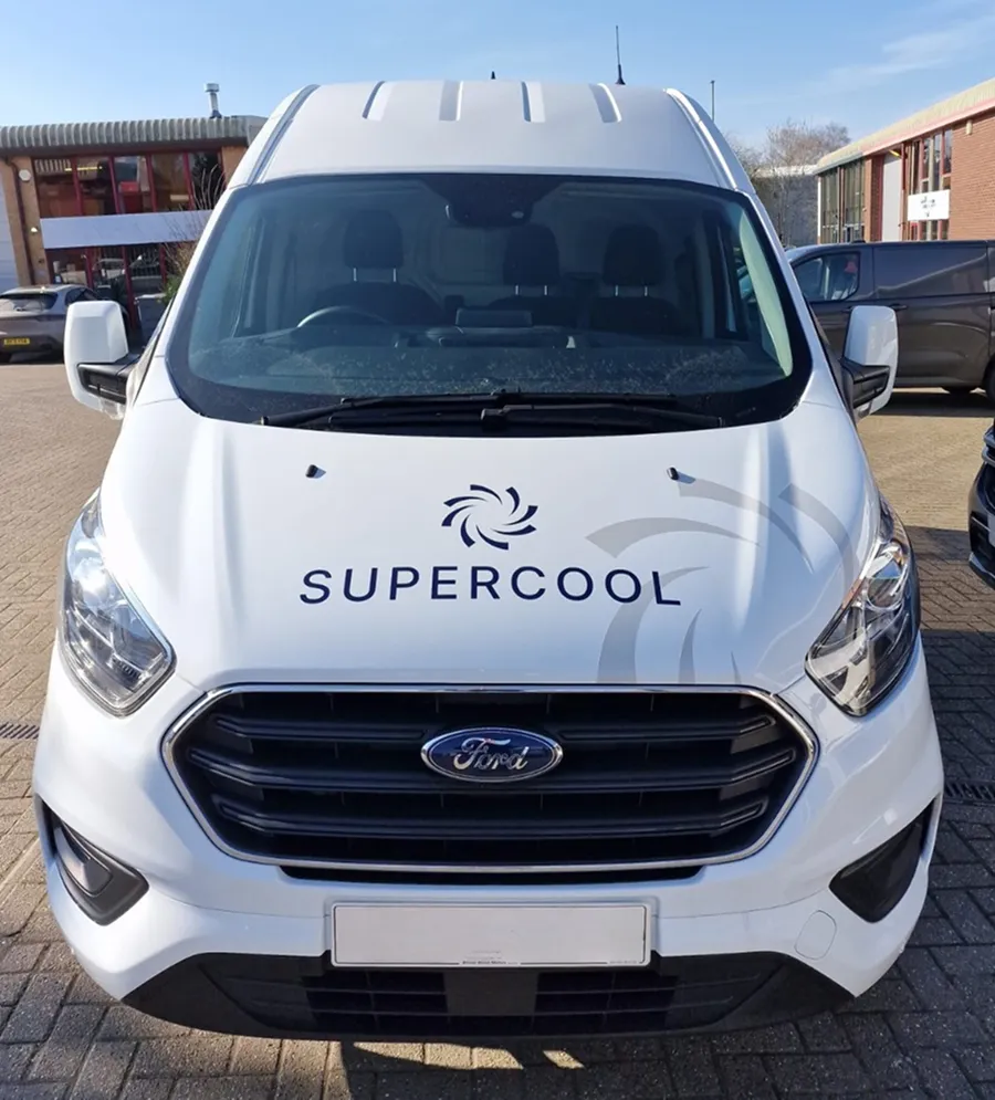 White Supercool branded van parked outdoors.