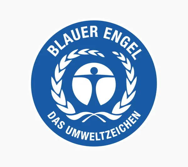 A close-up of the "Blauer Engel" (Blue Angel) logo, a German environmental certification. The logo features a blue circle with the text "Blauer Engel" and "Das Umweltzeichen" (The Environmental Label) surrounding a figure with outstretched arms and a laurel wreath. This image is relevant to sustainability in shared mobility as it represents a recognized standard for environmentally friendly products and services.