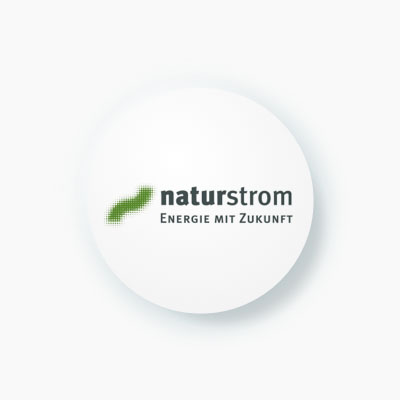 A round icon featuring the logo for "naturstrom," with the tagline "Energie mit Zukunft" (Energy with a future). 