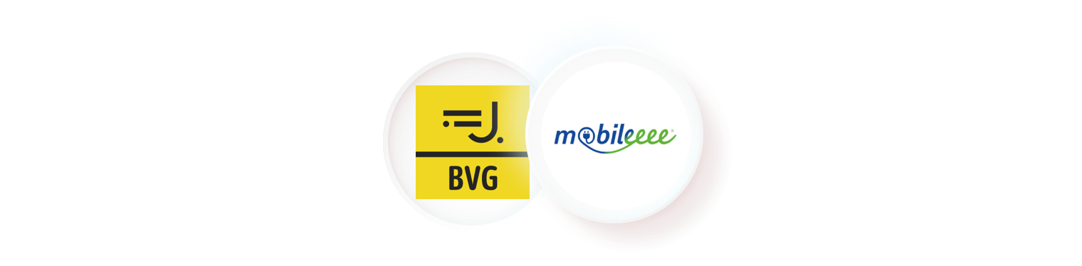 An illustration of two circular logos floating against a black background. The first logo is for "BVG" on a yellow and black background. The second is for "mobileeee" in blue and green text. This visual represents a partnership or integration between different mobility providers within an aggregator app.