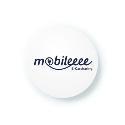 A simple, round icon with the logo for "mobileeee E-Carsharing." The logo features a charging plug integrated into the word "mobileeee."
