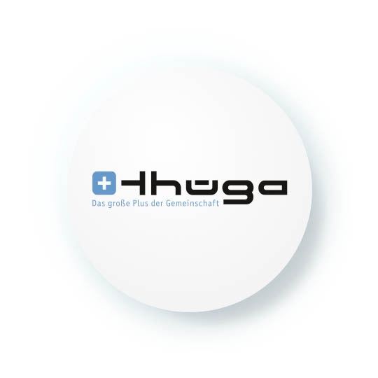 A white circle with a drop shadow features a black and blue logo. The logo, for a company called "Thüga," includes a blue square with a white cross and the text "Das große Plus der Gemeinschaft" (the big plus of cummunity) below it.