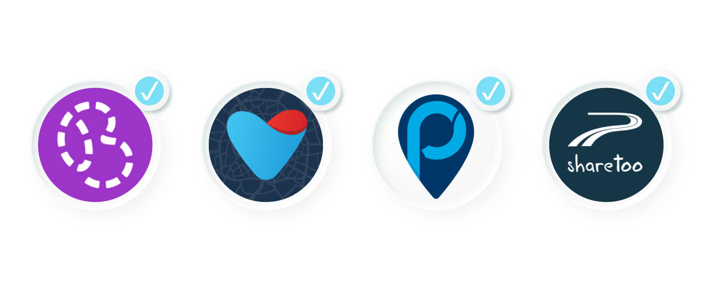 Four circular icons, each with a checkmark, representing different sharing providers that already migrated systems. The first icon has a dashed "B" shape on purple (bilkollektivet), the second a heart shape on a dark blue web pattern (Velocity), the third a blue map pin with a "p" in the middle (Popcar), and the fourth "sharetoo" text with a road icon.