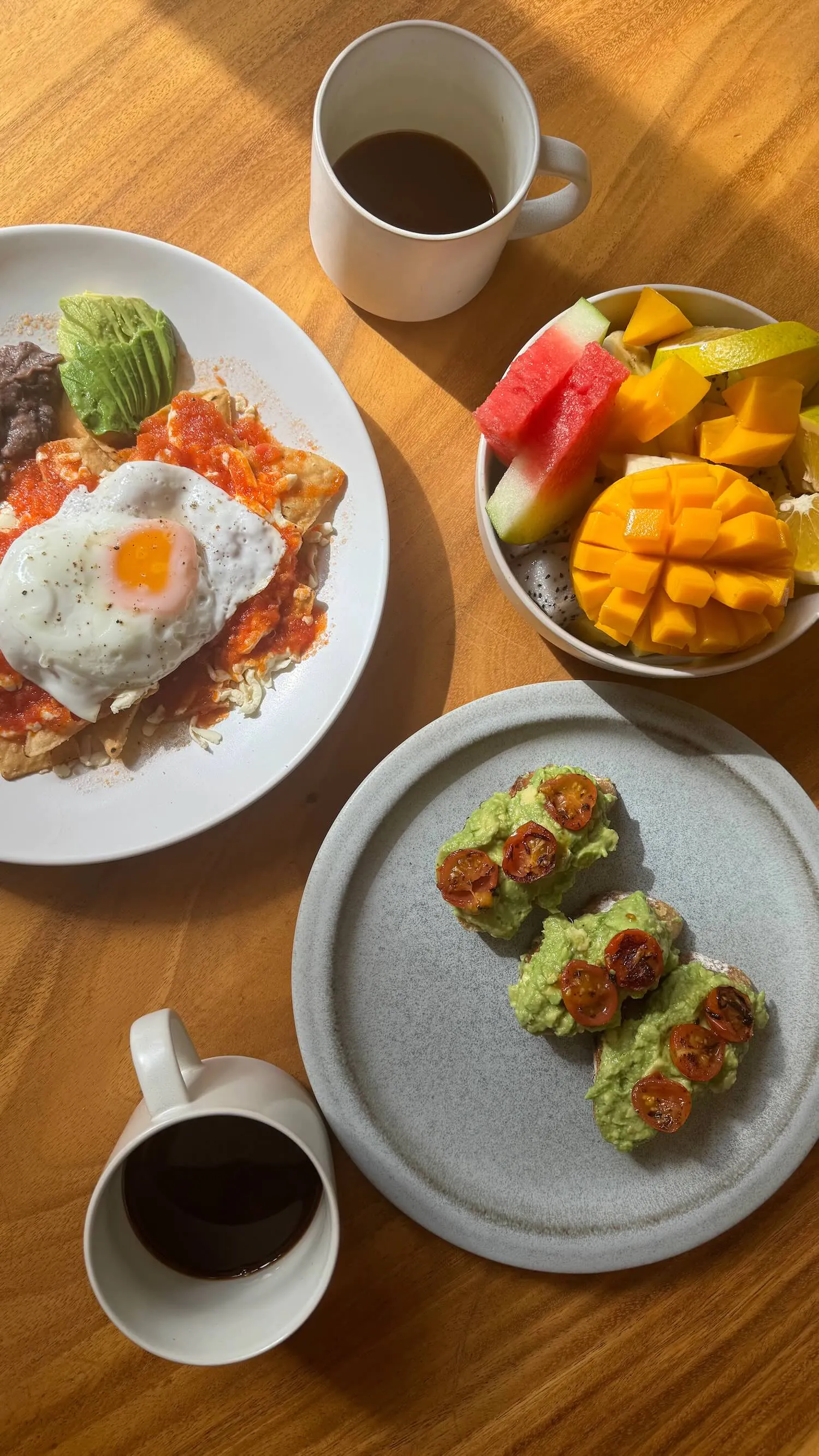 Breakfast foods and coffee set on a table.