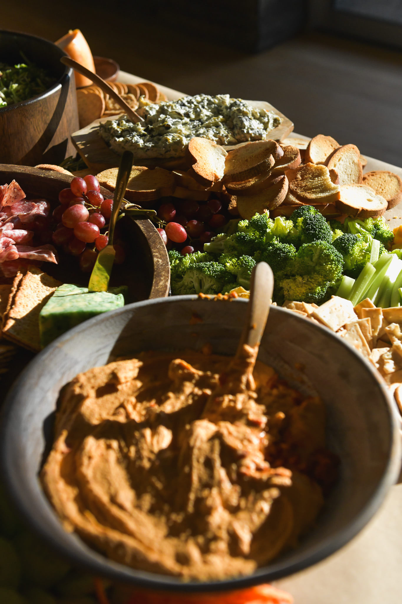 A dramatic photo of hummus and vegetables