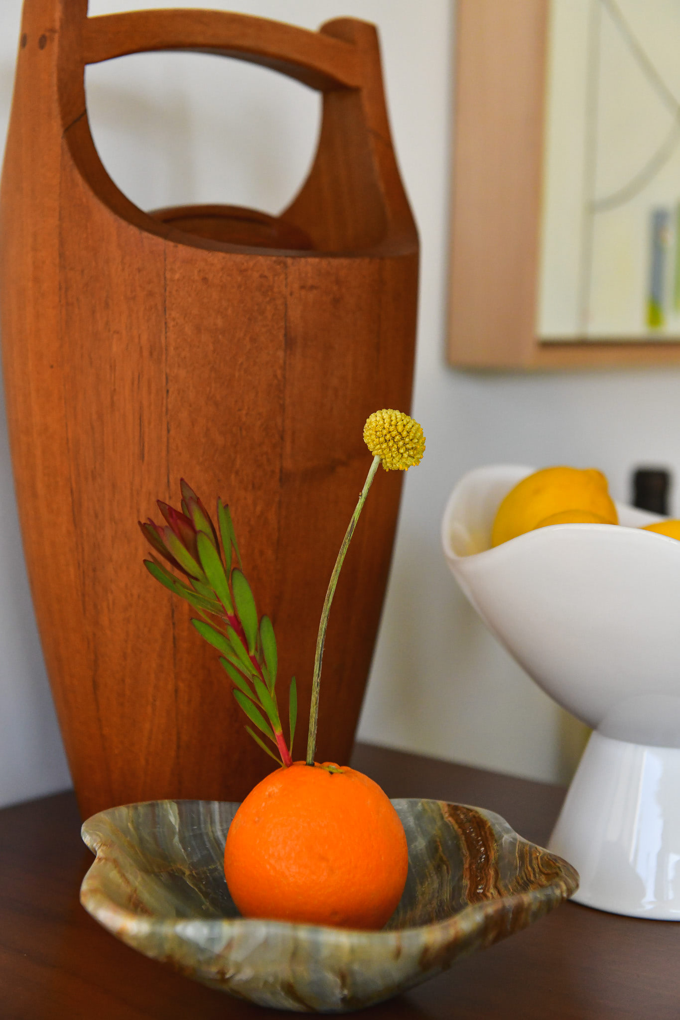 An orange decorated with florals on a bar