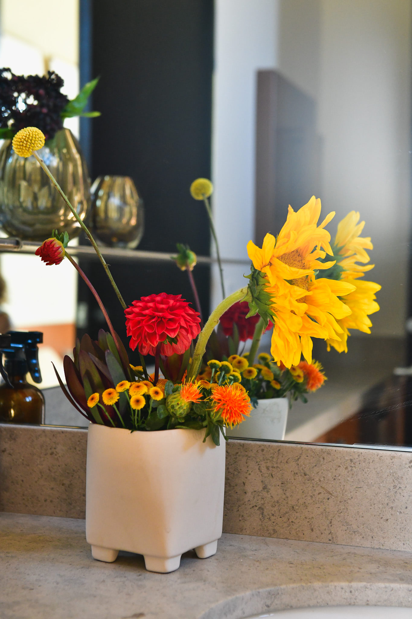 A dramatic arrangement of florals on a counter