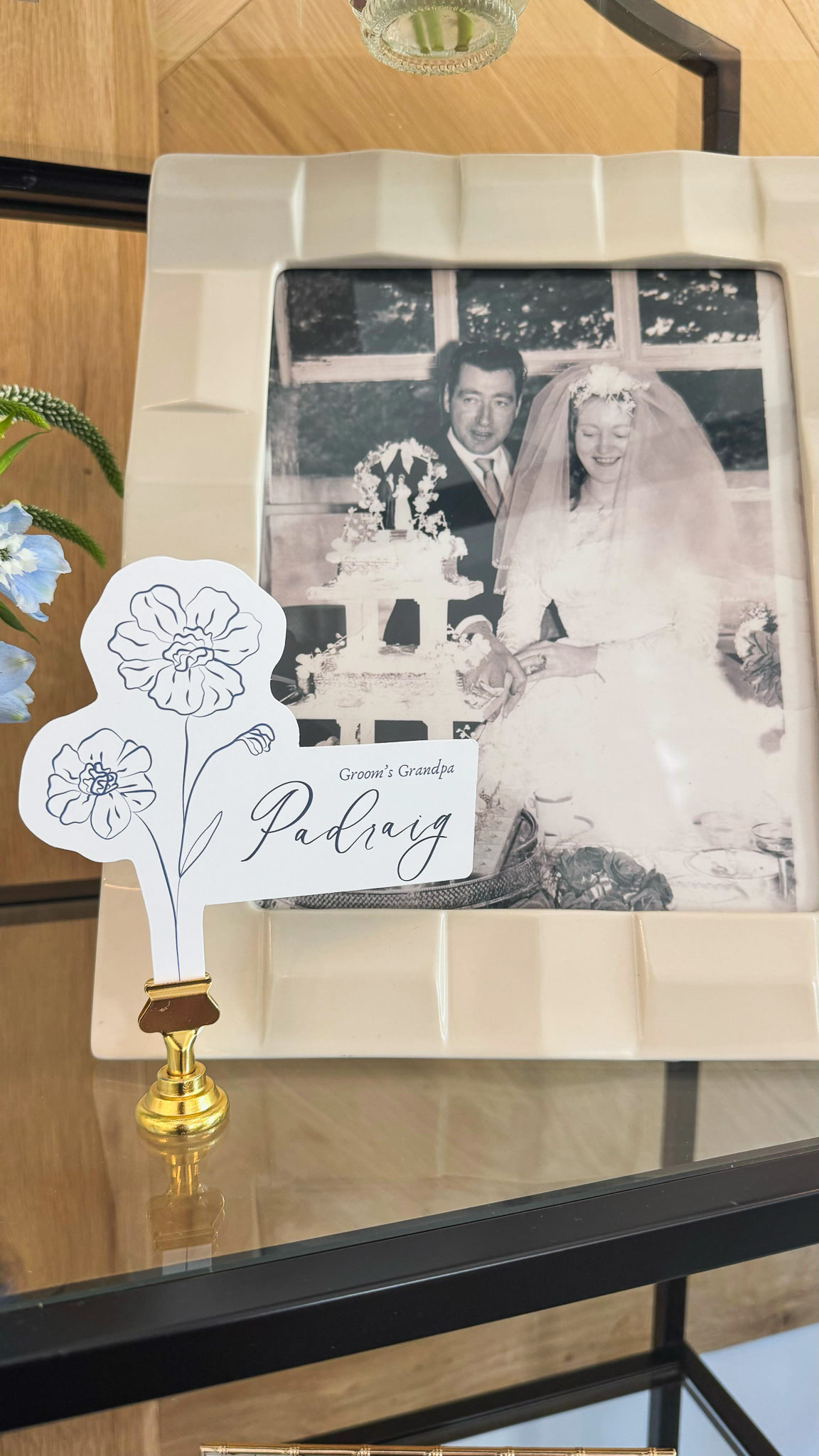 A vintage photo with an explanation that it's the groom's grandparents