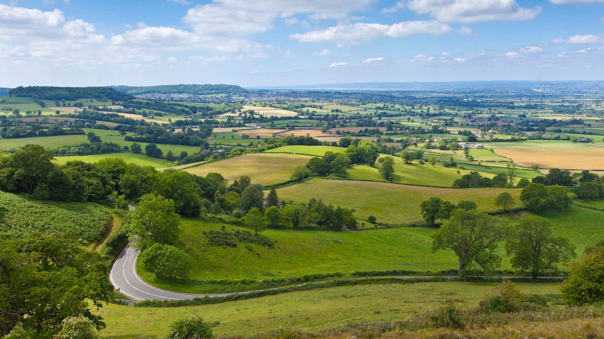 Aerial view of green fields in the UK — land selling options for owners